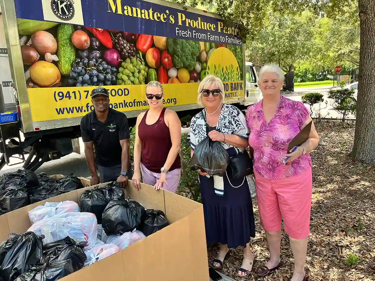 Volunteers by Manatee's Produce Pantry truck with donated food