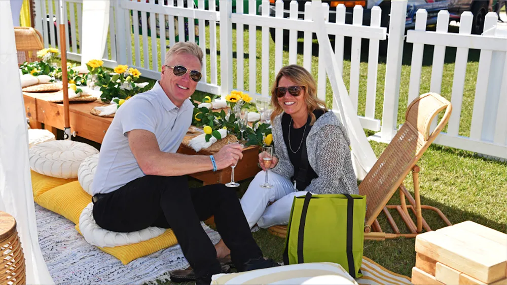 Couple enjoying drinks in the Suncoast Food & Wine Fest picnic lounge