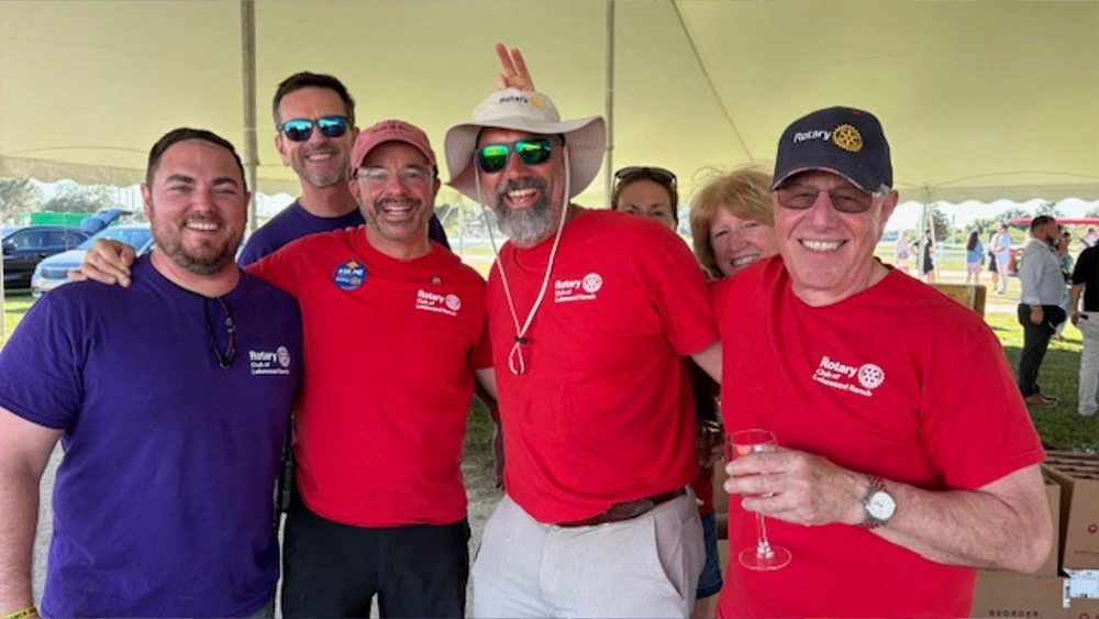 Group of Rotary Club of Lakewood Ranch volunteers posing together at the Suncoast Food & Wine Fest